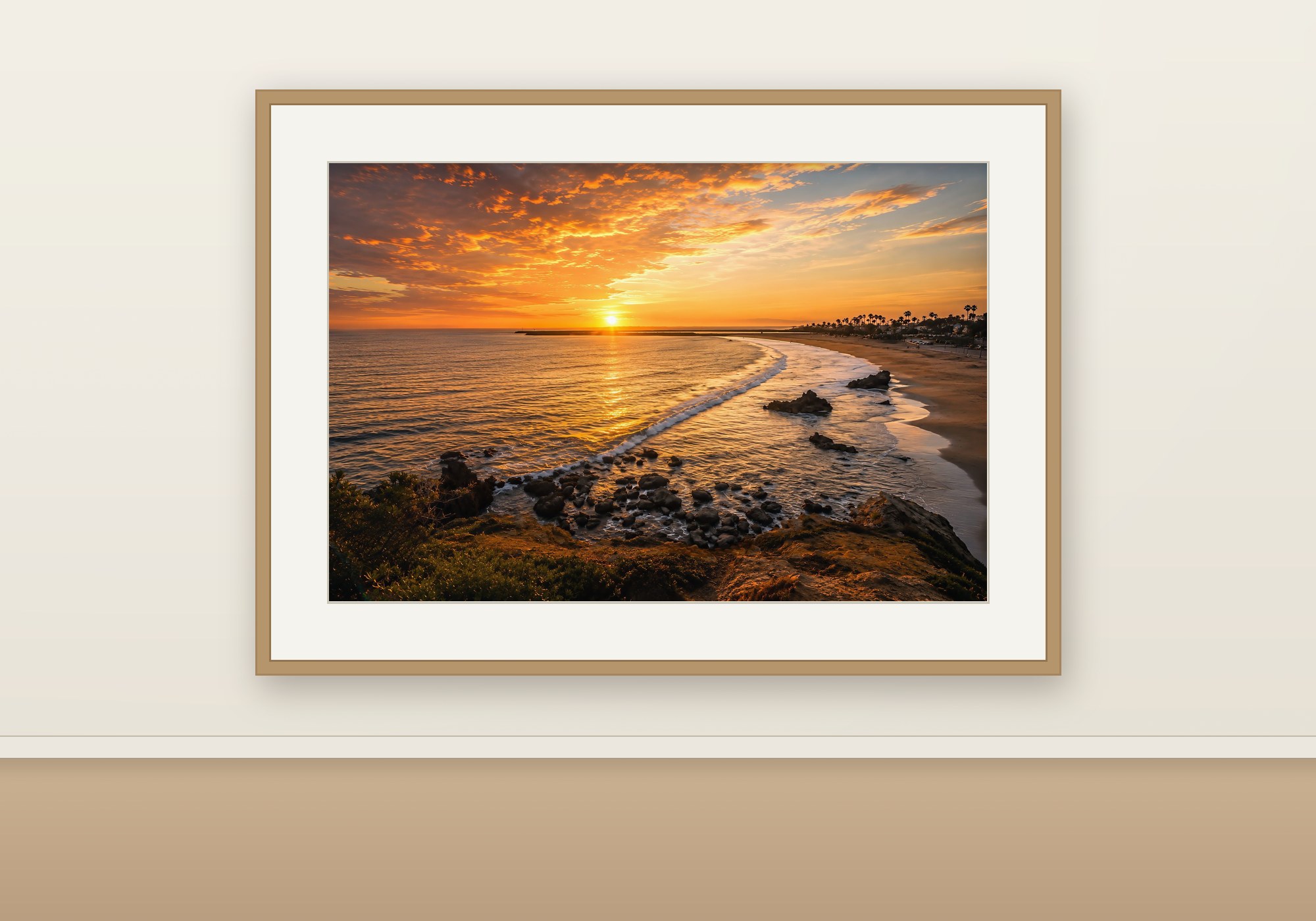 Corona del Mar sunset print framed in oak with a museum mat, shown to scale on a warm neutral wall