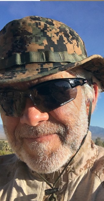 Steven Mitchell, photographer, in a Marine Corps field hat
